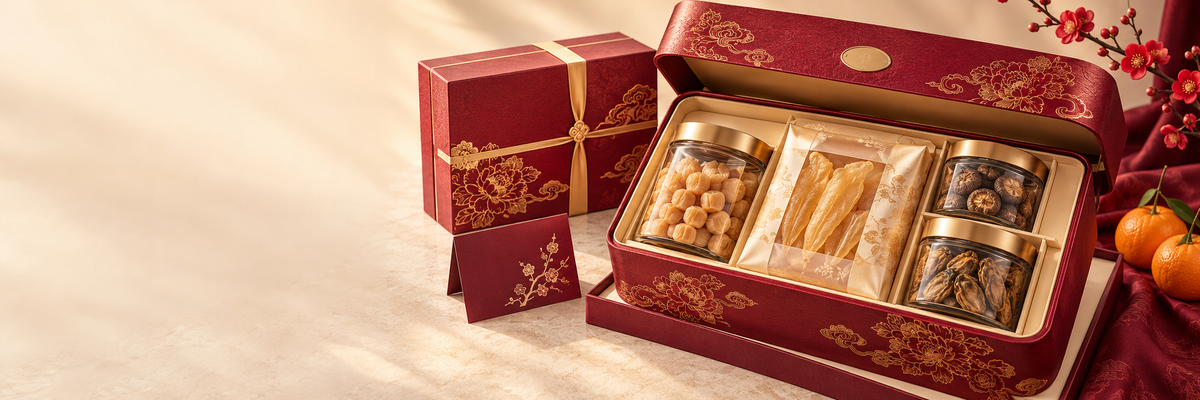 Maroon and gold Chinese New Year gift box with dried scallops, fish maw, shiitake mushrooms and dried oysters